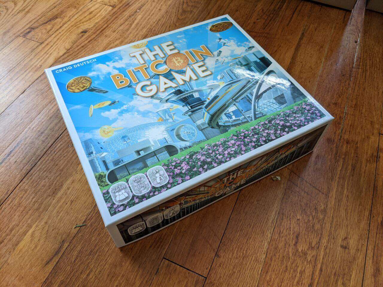 The Bitcoin Game board game box by Craig Deutsch.